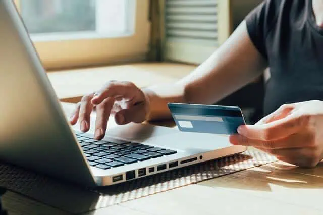 woman entering credit card information online