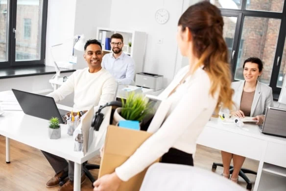 woman packing her things leaving job 1200