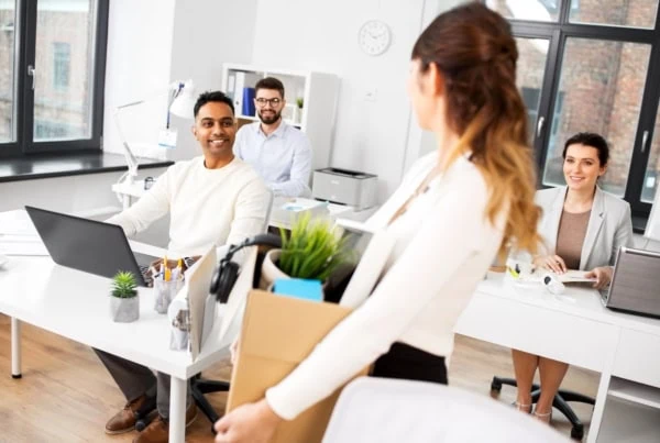 woman packing her things leaving job 1200