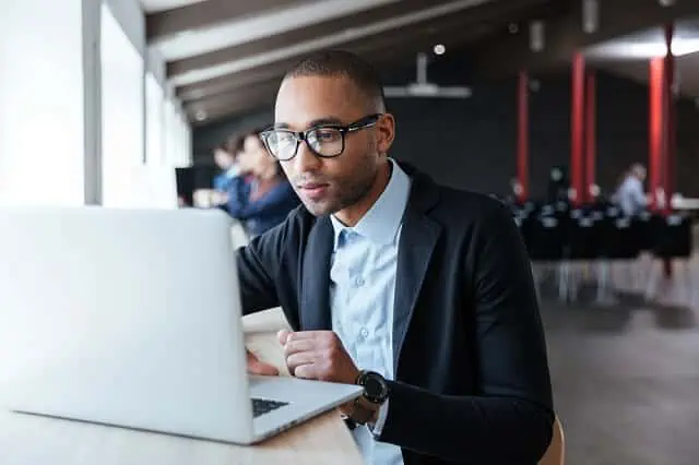 young man on laptop looking up information